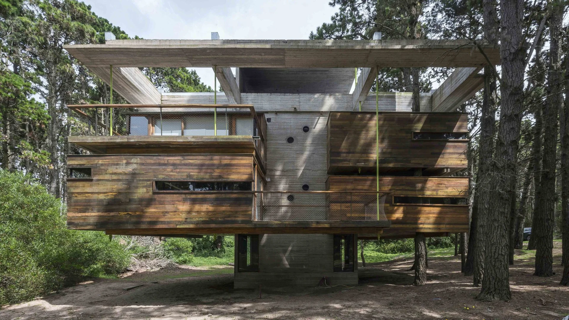 Elevated timber cabin in dunes by Atlantic Ocean, Argentina